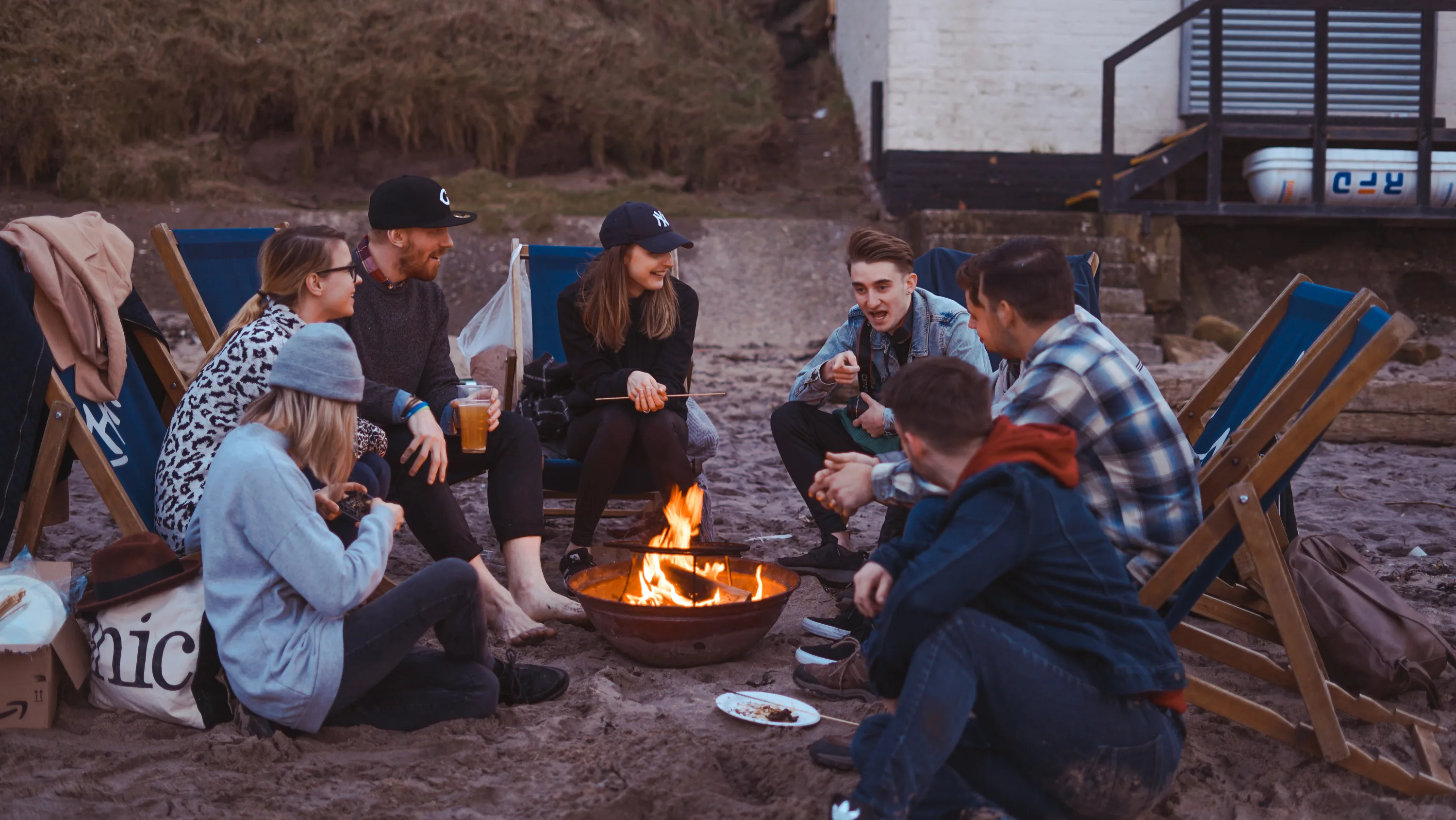 A diverse group of young people in a circle discussing importance of mental health